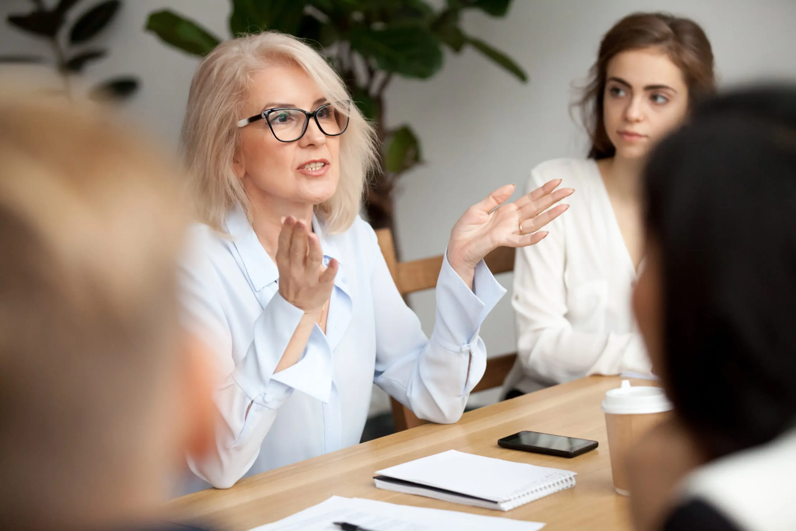 Woman explaining ideas in office meeting