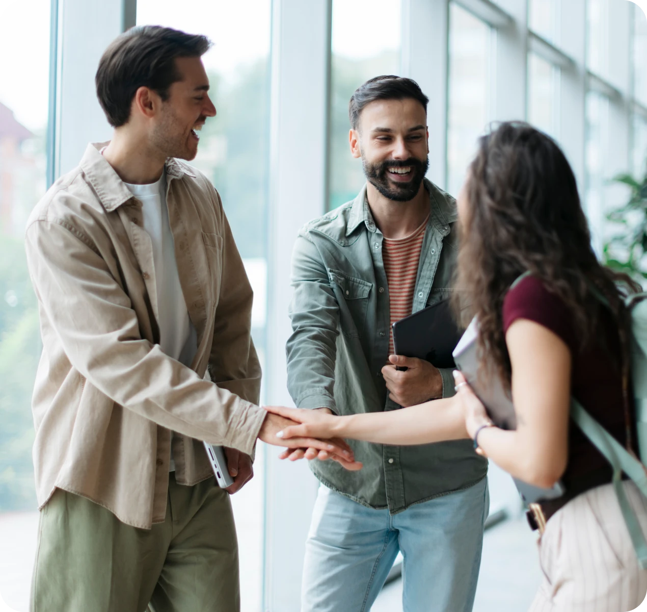 People greeting each other with handshakes